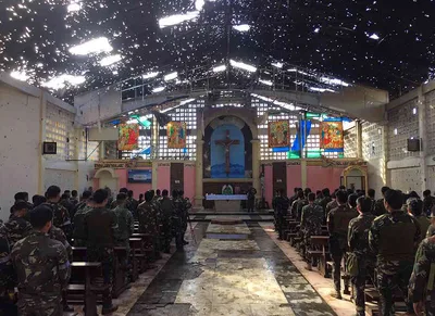 Soldiers attend Mass inside cathedral desecrated by Maute