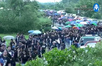 Sea of black as thousands flock to slain priest’s funeral