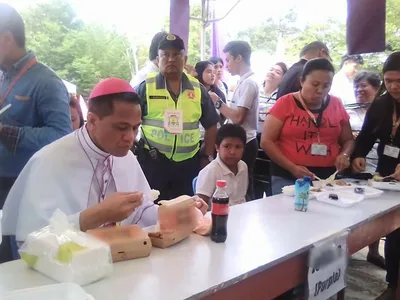 New bishop Dael dines with poor after ordination