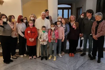 Pope Francis greets Ukraine war refugees before first papal flight of 2022