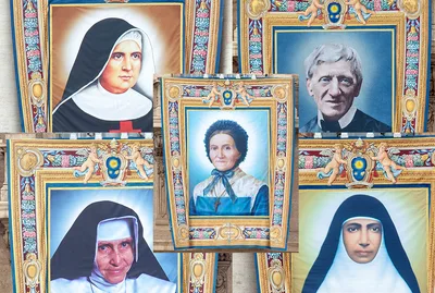 Banners unfurled as faithful share stories of five saints