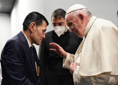 Pope Francis in Iraq meets with father whose children died as refugees in shipwreck