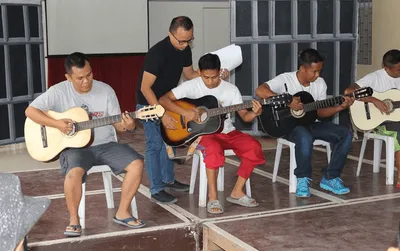 Inmates rediscover joy, faith through guitar lessons