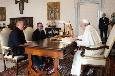 Pope Francis kisses hand of missionary priest, freed after two-year captivity in Africa