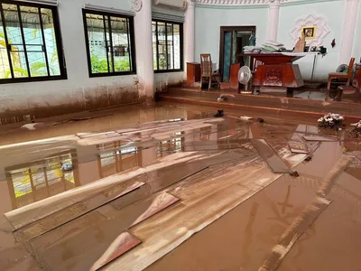 Church volunteers race to clear mud in wake of northern Thailand’s historic floods