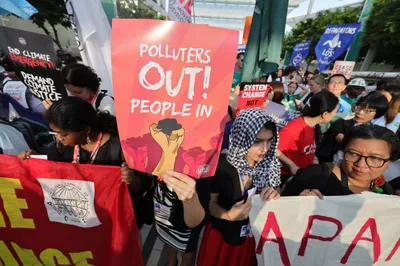 Environmental defenders protest at COP 28 in Dubai on international human rights day