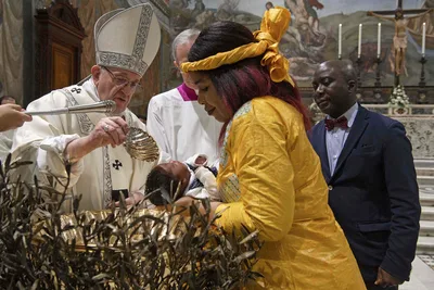 Faith is passed on at home, pope tells parents at baptism