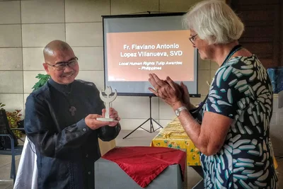 Priest honored for work with families of victims of drug-related killings