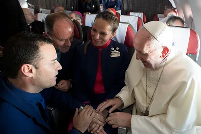 Pope marries couple on flight during Chilean trip