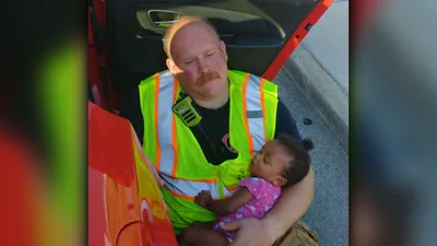 'This is Why I Do the Job’: Firefighter Cradles Baby After Car Crash