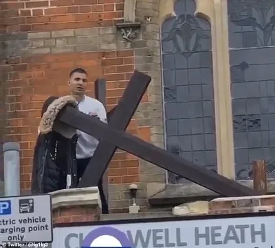 Church 'distressed' after vandal filmed trying to tear down cross