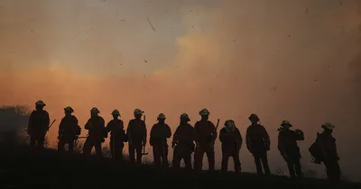 Thousands Move, Firefighters Injured in California Blazes