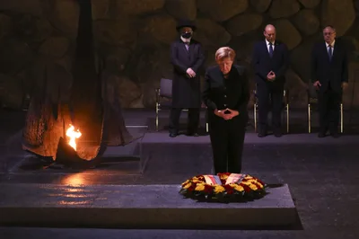 Germany’s Angela Merkel Vows ‘Never Again’ in Farewell Trip to Israel