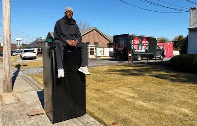Sitting Atop Fridge to Protest SNAP Cuts, Faith Leader Models Jesus’ ‘Proximity’ to the Poor