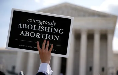 Idaho governor signs bill banning most abortions if Roe is overturned