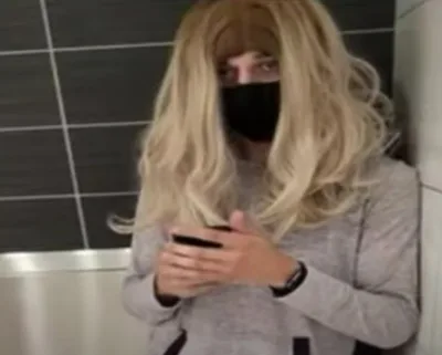 Amazon driver in blonde wig filmed naked girls in women's bathroom with pen camera, police say