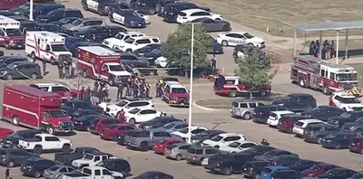 Texas high school shooting suspect turns himself in after wounding 4