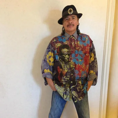 Carlos Santana retracts apology for saying 'a woman is a woman and a man is a man'