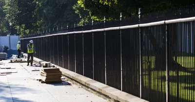 Wiggling kid defeats White House fence, is gently retrieved