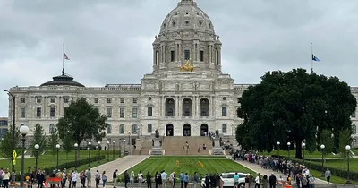 Assassinated Minnesota politician lies in state as suspect appears in court