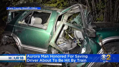 'There's a Train Coming!' Hero Rescues Unconscious Man From Train Tracks Just Seconds Before His Car Is Obliterated