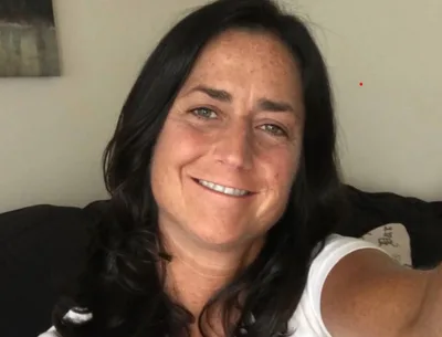 School staffer dies after troubled student kicks her in the chest
