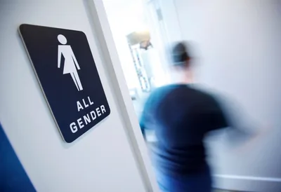 Students walkout after school district covers up urinals amid backlash to trans bathroom policy
