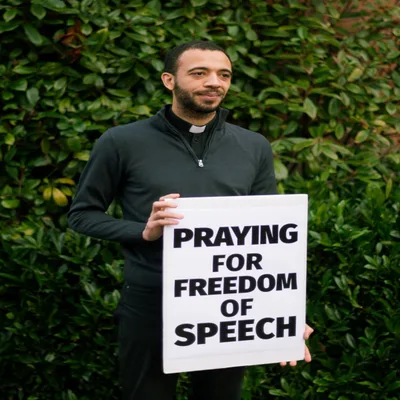 Priest Faces Legal Uncertainty after Praying Outside Closed Abortion Clinic
