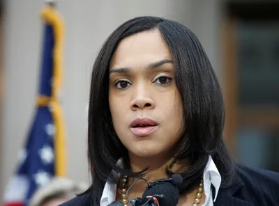 Marilyn Mosby pleads her innocence at Baltimore church after indictment; pastor calls charges 'demonic attack'