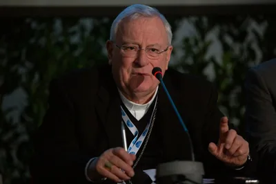 Convalescing cardinal prays for coronavirus sufferers
