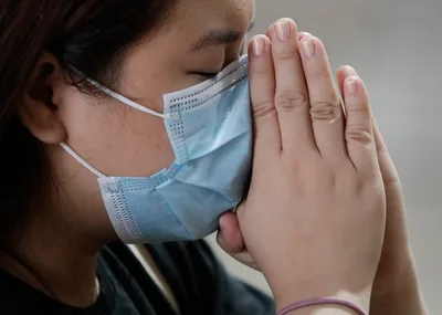 No Handshakes: Viral Outbreak Spooks Asian Places of Worship