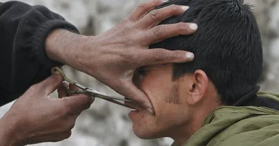 Taliban detaining men for Western hairstyles, UN reports
