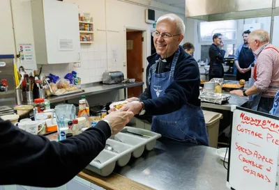 Archbishop of Canterbury Serves at Homeless Charity for the Big Help Out