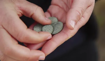 Archeologists Discover Rare 2nd Century Coin with Hebrew Inscription in Judean Desert
