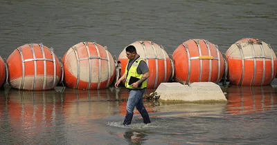 Texas faces off with Biden over floating barrier in Rio Grande