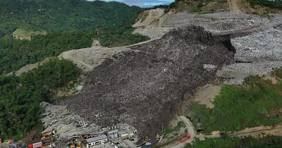 Dozens missing after Philippines garbage mound collapse, killing three