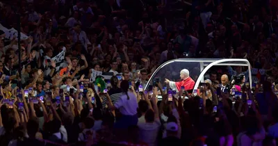 Thousands of young French Catholics converge on soccer stadium for prayer with Pope Leo