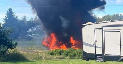 Fighter jet crashes in rural Michigan, neighborhood evacuated
