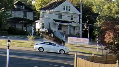 MUST SEE 'Miracle': Priest Unhurt After Black SUV Goes Airborne Over His Car