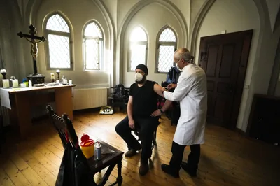 In Eastern Germany, Pastors Push for Shots Despite Protests