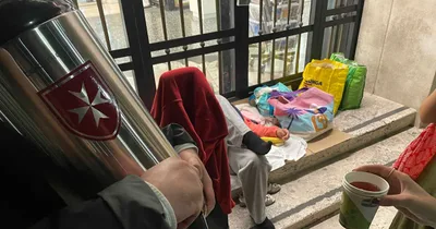 Young members of the Order of Malta help the homeless in St. Peter’s Square
