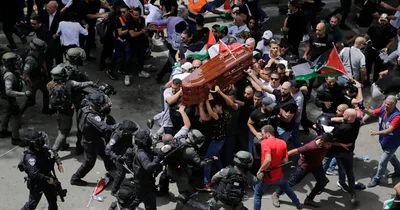 Israeli police clash with slain journalist’s mourners