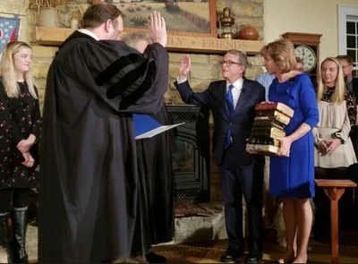 Ohio's new Gov. Mike DeWine swears on 9 Bibles during oath-of-office ceremony