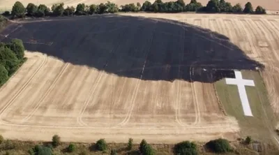 Memorial Cross Survives Fire That Swept through Field During Heatwave