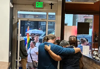Communists Harass Christian-Owned Café; Protesters Hold Signs Reading 'God is a f—''