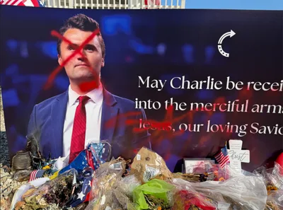 Charlie Kirk statue defaced with red paint; 'Jesus' crossed out, 'Satan' spray-painted over it
