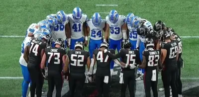 Lions, Falcons Huddle in Prayer as Ambulance Takes Injured Morice Norris Off Field