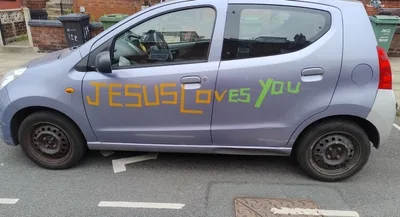Driver’s Car Insurance Revoked over ‘Jesus loves you’ Stickers