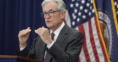 Stocks drop as the Fed keeps interest rates flat