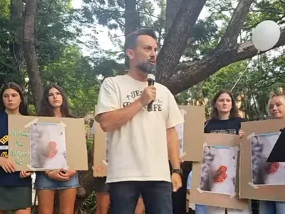 'Rally for Samuel' held in Brisbane after images allegedly show aborted boy dying while sucking his thumb